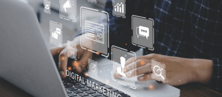 Hands typing on a laptop with digital marketing icons representing PPC Advertising